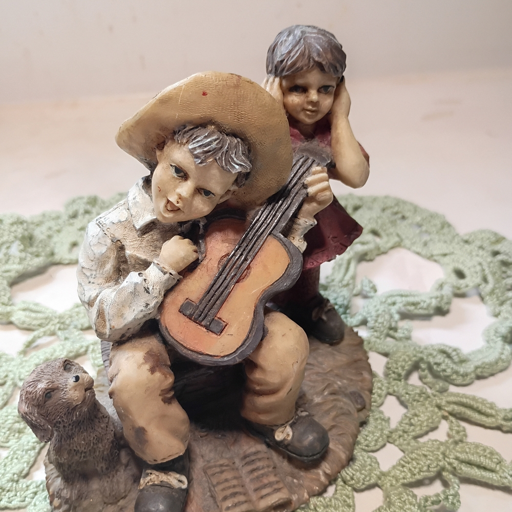 Unique Vintage Style Boy with Guitar, Dog, And Girl Covering Her Ears